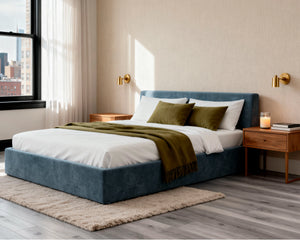# Side view of O2 Soft Frame Bed in Hydrogen Blue, showcasing its minimalist design with a soft, low-profile foam structure and simple, clean lines.
