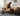 Man inserting a lightweight sofa module into an M1 Faux Leather modular sofa in a living room.